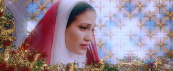 Movie still from “The Cell” (2000), directed by Tarsem Singh – A person wearing a veil; Close Up shot, High angle