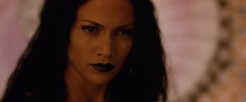 Movie still from “The Cell” (2000), directed by Tarsem Singh – A person with dark lipstick; Close Up shot, Over the shoulder angle