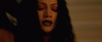 Movie still from “The Cell” (2000), directed by Tarsem Singh – A person with dark makeup on; Close Up shot, Low angle