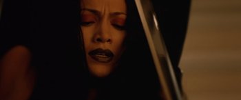 Movie still from “The Cell” (2000), directed by Tarsem Singh – A person holding a guitar; Extreme Close Up shot, Low angle