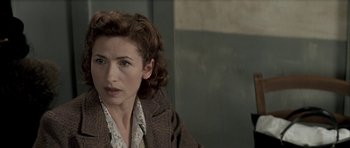 Movie still from “The Chorus” (2004), directed by Christophe Barratier – A person wearing a jacket; Close Up shot, Over the shoulder angle