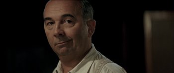 Movie still from “The Chorus” (2004), directed by Christophe Barratier – A person wearing a white shirt; Close Up shot, Over the shoulder angle