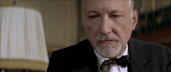 Movie still from “The Chorus” (2004), directed by Christophe Barratier – An older man wearing a suit and bow tie; Close Up shot, Low angle