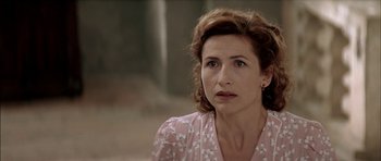 Movie still from “The Chorus” (2004), directed by Christophe Barratier – A person wearing a pink shirt; Close Up shot, Over the shoulder angle