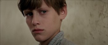 Movie still from “The Chorus” (2004), directed by Christophe Barratier – A young boy's face; Close Up shot, Over the shoulder angle