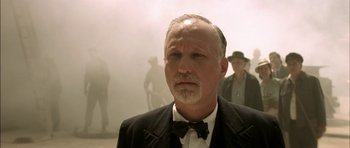 Movie still from “The Chorus” (2004), directed by Christophe Barratier – An older man wearing a suit and bow tie; Close Up shot, Low angle