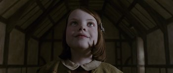 Movie still from “The Chronicles of Narnia: The Lion, the Witch and the Wardrobe” (2005), directed by Andrew Adamson – A young girl looking up into the sky; Close Up shot, Low angle