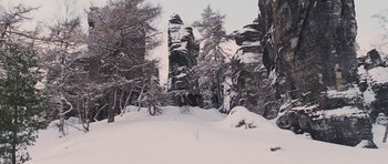 Movie still from “The Chronicles of Narnia: The Lion, the Witch and the Wardrobe” (2005), directed by Andrew Adamson – A person riding a horse through the snow; Extreme Wide shot, High angle
