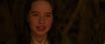 Movie still from “The Chronicles of Narnia: The Lion, the Witch and the Wardrobe” (2005), directed by Andrew Adamson – A young girl smiling for the camera with her teeth missing; Close Up shot, High angle