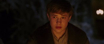 Movie still from “The Chronicles of Narnia: The Lion, the Witch and the Wardrobe” (2005), directed by Andrew Adamson – A young man is looking into the camera; Close Up shot, High angle