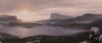 Movie still from “The Chronicles of Narnia: The Lion, the Witch and the Wardrobe” (2005), directed by Andrew Adamson – A view of a mountain and a body of water in the distance; Extreme Wide shot, Low angle