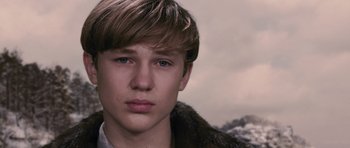 Movie still from “The Chronicles of Narnia: The Lion, the Witch and the Wardrobe” (2005), directed by Andrew Adamson – A person wearing a fur coat; Close Up shot, Low angle