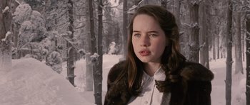 Movie still from “The Chronicles of Narnia: The Lion, the Witch and the Wardrobe” (2005), directed by Andrew Adamson – A young woman in a fur coat standing in the snow; Close Up shot, Over the shoulder angle