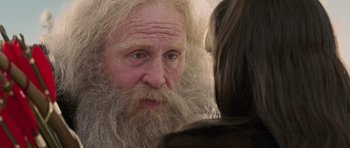 Movie still from “The Chronicles of Narnia: The Lion, the Witch and the Wardrobe” (2005), directed by Andrew Adamson – An old man with long white beard looking at a woman; Close Up shot, Over the shoulder angle