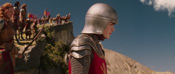 Movie still from “The Chronicles of Narnia: The Lion, the Witch and the Wardrobe” (2005), directed by Andrew Adamson – A man in a suit of armor standing in front of a mountain; Medium shot, Low angle