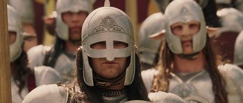 Movie still from “The Chronicles of Narnia: The Lion, the Witch and the Wardrobe” (2005), directed by Andrew Adamson – A group of people wearing helmets and long hair; Close Up shot, Low angle