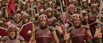 Movie still from “The Chronicles of Narnia: The Lion, the Witch and the Wardrobe” (2005), directed by Andrew Adamson – A group of people dressed in red and gold armor; Medium shot, High angle