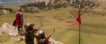 Movie still from “The Chronicles of Narnia: The Lion, the Witch and the Wardrobe” (2005), directed by Andrew Adamson – Two people are flying a kite on a mountain; Extreme Wide shot, High angle