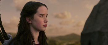 Movie still from “The Chronicles of Narnia: The Lion, the Witch and the Wardrobe” (2005), directed by Andrew Adamson – A young woman looking off into the distance; Close Up shot, Low angle
