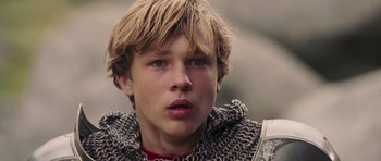 Movie still from “The Chronicles of Narnia: The Lion, the Witch and the Wardrobe” (2005), directed by Andrew Adamson – A person wearing a chain mail jacket; Close Up shot, Low angle