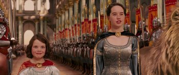 Movie still from “The Chronicles of Narnia: The Lion, the Witch and the Wardrobe” (2005), directed by Andrew Adamson – A woman standing in front of a row of soldiers; Medium shot, Over the shoulder angle