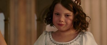 Movie still from “The Chronicles of Narnia: The Lion, the Witch and the Wardrobe” (2005), directed by Andrew Adamson – A young girl wearing a white dress and a tiara; Close Up shot, High angle
