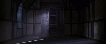 Movie still from “The Chronicles of Narnia: The Lion, the Witch and the Wardrobe” (2005), directed by Andrew Adamson – The light is shining through a window in a room; Wide shot, Low angle