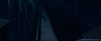 Movie still from “The Chronicles of Narnia: Prince Caspian” (2008), directed by Andrew Adamson – A cat walking down a ramp in the dark; Extreme Wide shot, High angle