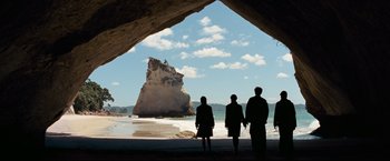 Movie still from “The Chronicles of Narnia: Prince Caspian” (2008), directed by Andrew Adamson – A group of people standing on the beach looking out at the ocean; Extreme Wide shot, Over the shoulder angle