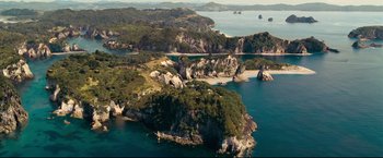 Movie still from “The Chronicles of Narnia: Prince Caspian” (2008), directed by Andrew Adamson – An aerial view of a body of water with a lot of trees; Extreme Wide shot, High angle
