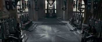 Movie still from “The Chronicles of Narnia: Prince Caspian” (2008), directed by Andrew Adamson – A large room with stairs leading up to a large window; Extreme Wide shot, High angle