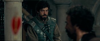 Movie still from “The Chronicles of Narnia: Prince Caspian” (2008), directed by Andrew Adamson – A man with a beard wearing a leather vest; Medium shot, Over the shoulder angle