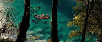 Movie still from “The Chronicles of Narnia: Prince Caspian” (2008), directed by Andrew Adamson – A group of people in a boat in the water; Extreme Wide shot, Overhead angle
