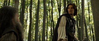 Movie still from “The Chronicles of Narnia: Prince Caspian” (2008), directed by Andrew Adamson – A woman in medieval garb standing in the woods; Medium shot, Low angle