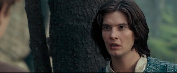 Movie still from “The Chronicles of Narnia: Prince Caspian” (2008), directed by Andrew Adamson – A person with long dark hair; Close Up shot, Over the shoulder angle