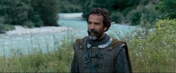 Movie still from “The Chronicles of Narnia: Prince Caspian” (2008), directed by Andrew Adamson – A man with a long beard wearing armor; Medium shot, Low angle