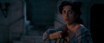 Movie still from “The Chronicles of Narnia: Prince Caspian” (2008), directed by Andrew Adamson – A woman holding onto a rope in a dark room; Close Up shot, Over the shoulder angle