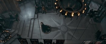 Movie still from “The Chronicles of Narnia: Prince Caspian” (2008), directed by Andrew Adamson – A woman is standing in the middle of a room; Extreme Wide shot, Overhead angle