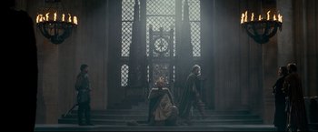 Movie still from “The Chronicles of Narnia: Prince Caspian” (2008), directed by Andrew Adamson – Two men dressed in medieval clothing in front of a clock tower; Wide shot, Low angle