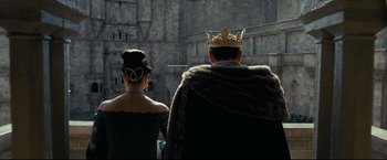 Movie still from “The Chronicles of Narnia: Prince Caspian” (2008), directed by Andrew Adamson – A man and a woman in medieval garb looking at each other; Wide shot, Low angle