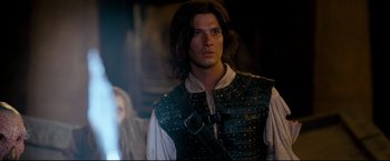 Movie still from “The Chronicles of Narnia: Prince Caspian” (2008), directed by Andrew Adamson – A person wearing a leather vest; Medium shot, Over the shoulder angle