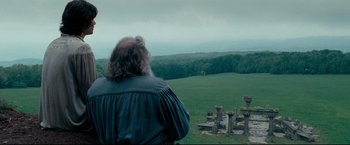 Movie still from “The Chronicles of Narnia: Prince Caspian” (2008), directed by Andrew Adamson – A man standing in a field looking out at a forest; Extreme Wide shot, Low angle