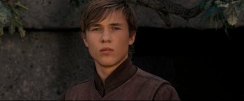 Movie still from “The Chronicles of Narnia: Prince Caspian” (2008), directed by Andrew Adamson – A young man in a brown jacket looking at the camera; Close Up shot, Low angle