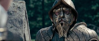 Movie still from “The Chronicles of Narnia: Prince Caspian” (2008), directed by Andrew Adamson – A man with a face mask and a helmet on; Close Up shot, Over the shoulder angle