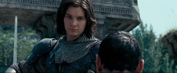 Movie still from “The Chronicles of Narnia: Prince Caspian” (2008), directed by Andrew Adamson – A person wearing a chain mail armor; Close Up shot, Over the shoulder angle