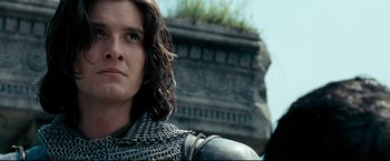 Movie still from “The Chronicles of Narnia: Prince Caspian” (2008), directed by Andrew Adamson – A person wearing a chain mail armor; Close Up shot, Low angle