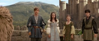 Movie still from “The Chronicles of Narnia: Prince Caspian” (2008), directed by Andrew Adamson – A group of people standing next to each other on top of a hill; Medium shot, Low angle