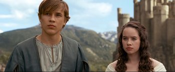 Movie still from “The Chronicles of Narnia: Prince Caspian” (2008), directed by Andrew Adamson – A young man standing next to a young woman in front of mountains; Medium shot, Over the shoulder angle
