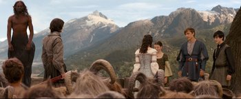 Movie still from “The Chronicles of Narnia: Prince Caspian” (2008), directed by Andrew Adamson – Two women are hugging in front of a mountain; Wide shot, High angle