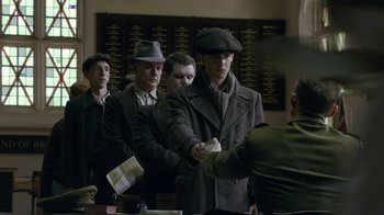 A group of men standing in front of each other